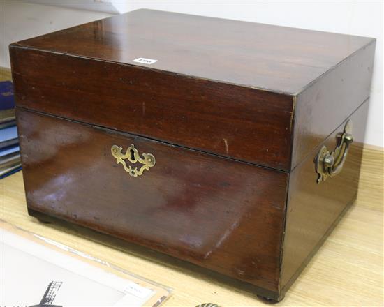 A Georgian mahogany travelling box with brass escutcheon and carrying handles and bun feet, H 32cm W 48cm D 37cm